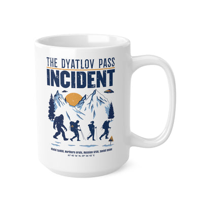 White mug of 3 hikers including Bigfoot in snowy mountains with UFOs and text THE DYATLOV PASS INCIDENT.