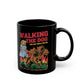 Black mug of a girl taking Cerberus dog for a walk with text WALKING THE DOG JUST GOT TRIPLE THE FUN.