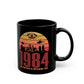 Black mug of a dystopian city silhouette on a retro sun with text 1984 BIG BROTHER IS WATCHING YOU!