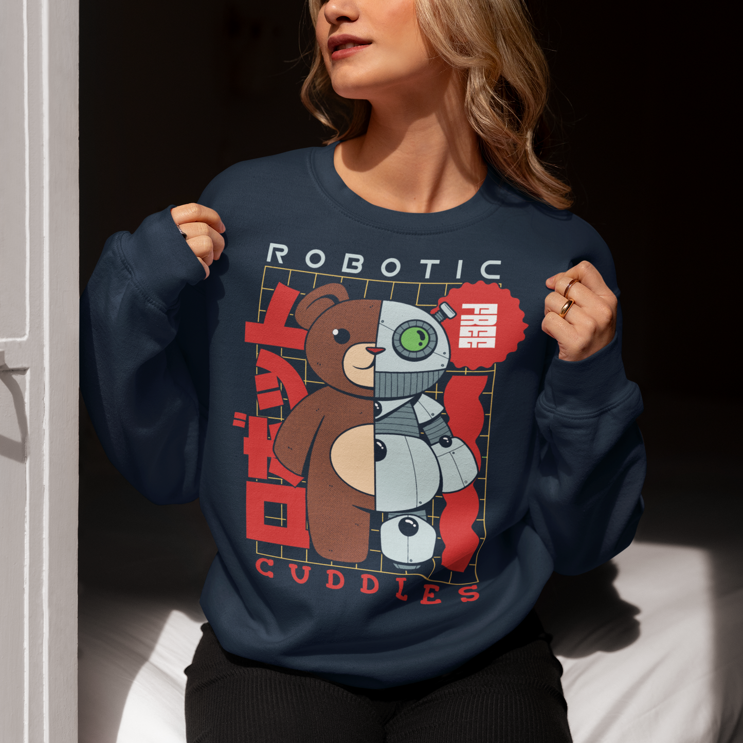 Navy sweatshirt of a half robot teddy bear with text ROBOTIC CUDDLES.