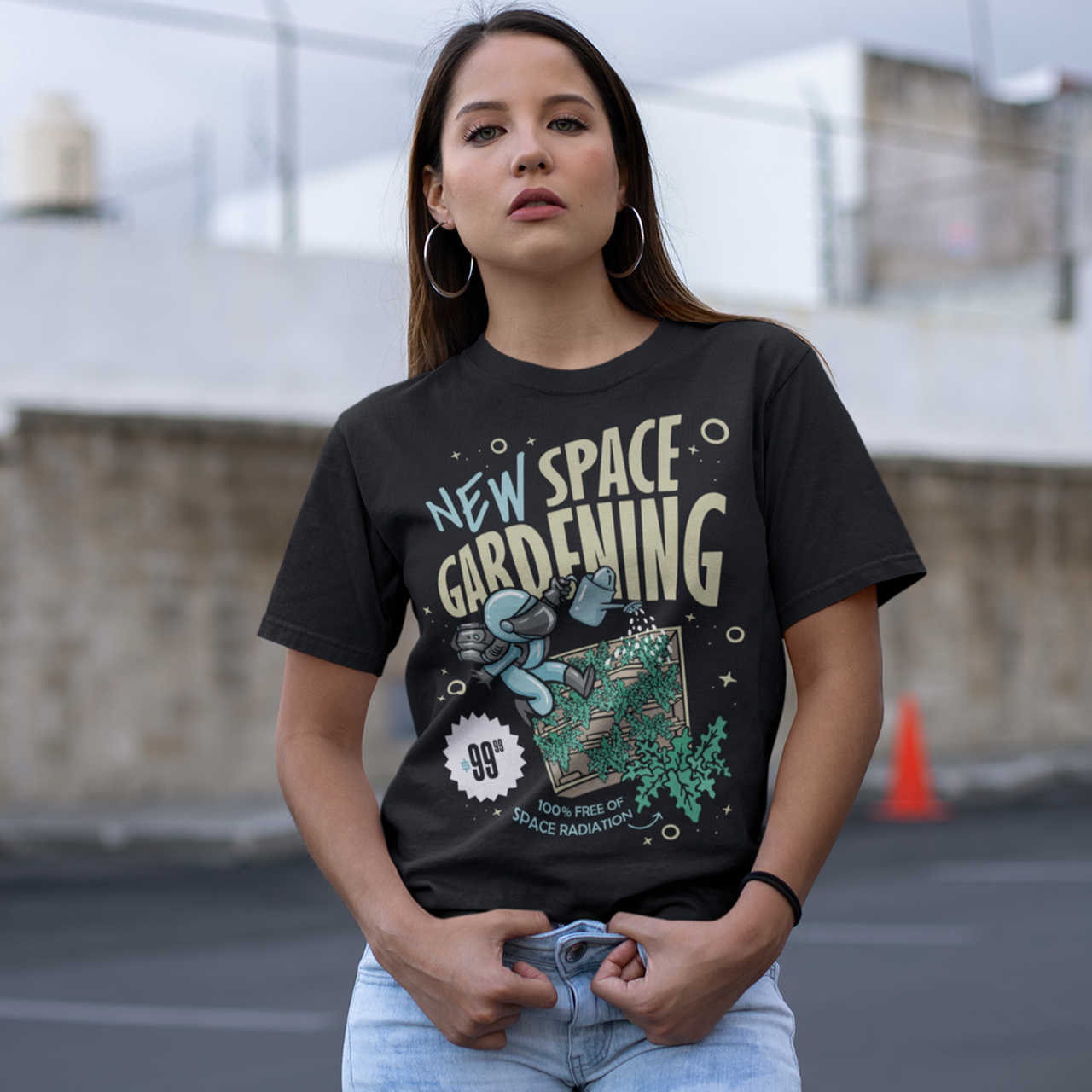 Black t-shirt with space man gardening in space with text "NEW SPACE GARDENING"