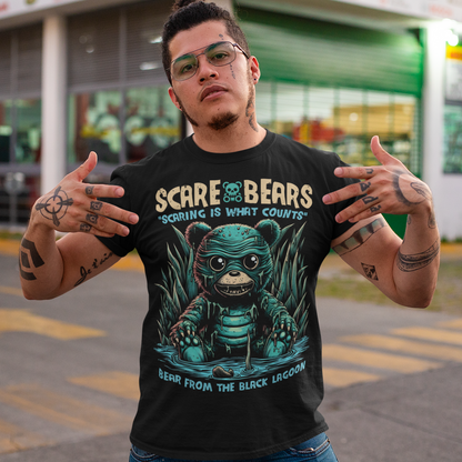 Introducing the Scare Bears T-Shirt! This eerie tee features a creature from the black lagoon, but with a twist: it’s a bear! Sitting ominously in a misty swamp, this monstrous bear peers out with glowing eyes, half-submerged in murky waters and surrounded by twisted trees and eerie shadows.