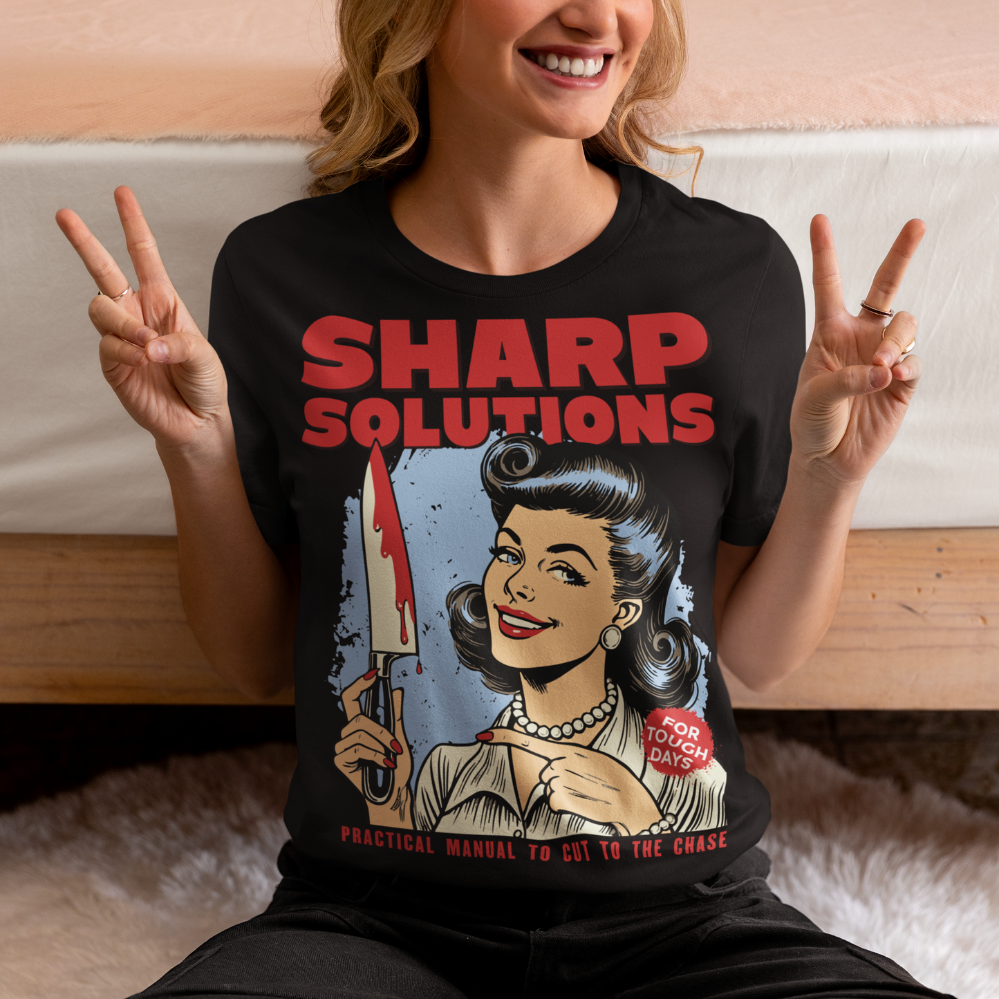 Slice through the stress of everyday life with this bold and cheeky “Sharp Solutions” retro-style T-shirt. Designed in a classic vintage aesthetic, it features a 1950s housewife confidently holding a dripping knife with a charming smile, paired with tongue-in-cheek text that adds the perfect dose of dark humor. Ideal for fans of edgy throwback art, sarcastic designs, and quirky graphic tees, this shirt makes a standout gift and a fun conversation starter wherever you wear it.