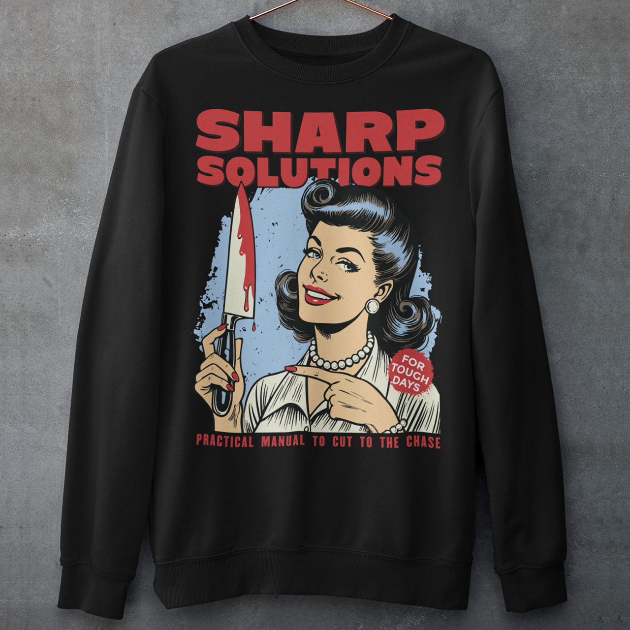 Slice through the stress of everyday life with this bold and cheeky “Sharp Solutions” retro-style Sweatshirt. Designed in a classic vintage aesthetic, it features a 1950s housewife confidently holding a dripping knife with a charming smile, paired with tongue-in-cheek text that adds the perfect dose of dark humor. Ideal for fans of edgy throwback art, sarcastic designs, and quirky graphic tees, this shirt makes a standout gift and a fun conversation starter wherever you wear it.