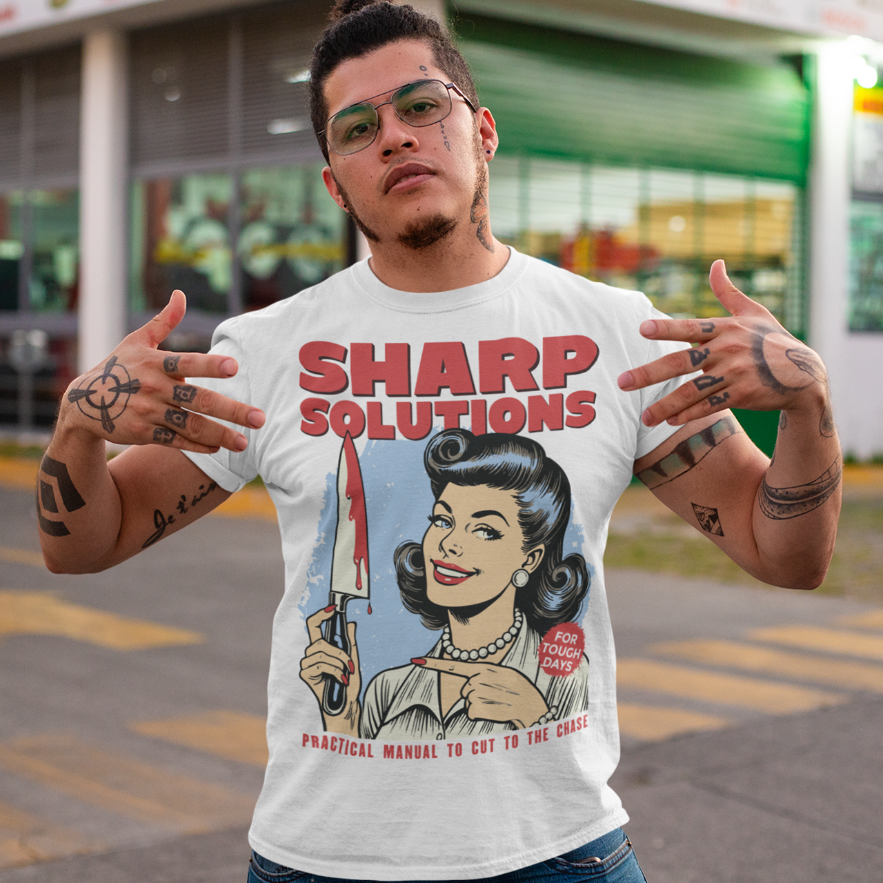Slice through the stress of everyday life with this bold and cheeky “Sharp Solutions” retro-style T-shirt. Designed in a classic vintage aesthetic, it features a 1950s housewife confidently holding a dripping knife with a charming smile, paired with tongue-in-cheek text that adds the perfect dose of dark humor. Ideal for fans of edgy throwback art, sarcastic designs, and quirky graphic tees, this shirt makes a standout gift and a fun conversation starter wherever you wear it.