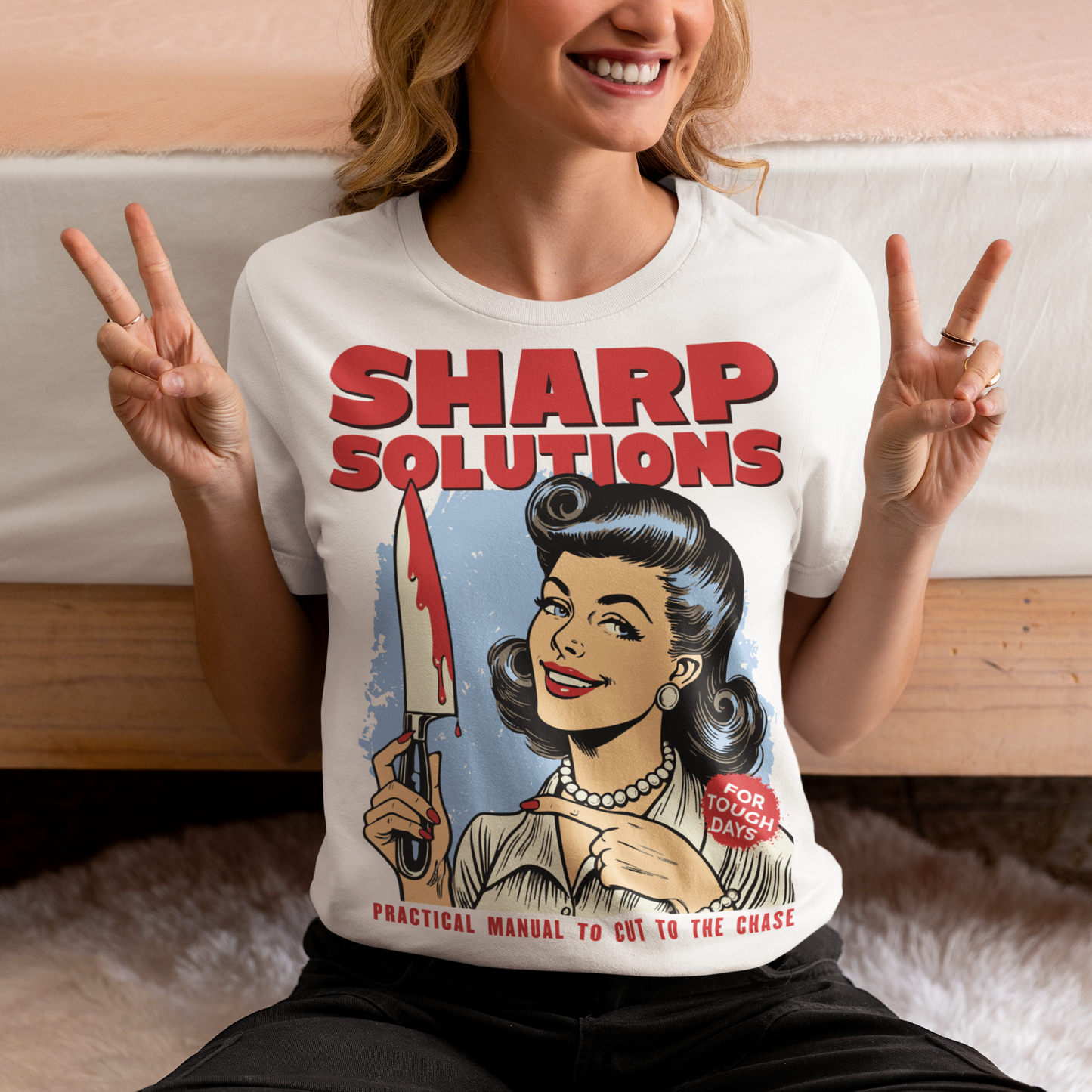 Slice through the stress of everyday life with this bold and cheeky “Sharp Solutions” retro-style T-shirt. Designed in a classic vintage aesthetic, it features a 1950s housewife confidently holding a dripping knife with a charming smile, paired with tongue-in-cheek text that adds the perfect dose of dark humor. Ideal for fans of edgy throwback art, sarcastic designs, and quirky graphic tees, this shirt makes a standout gift and a fun conversation starter wherever you wear it.