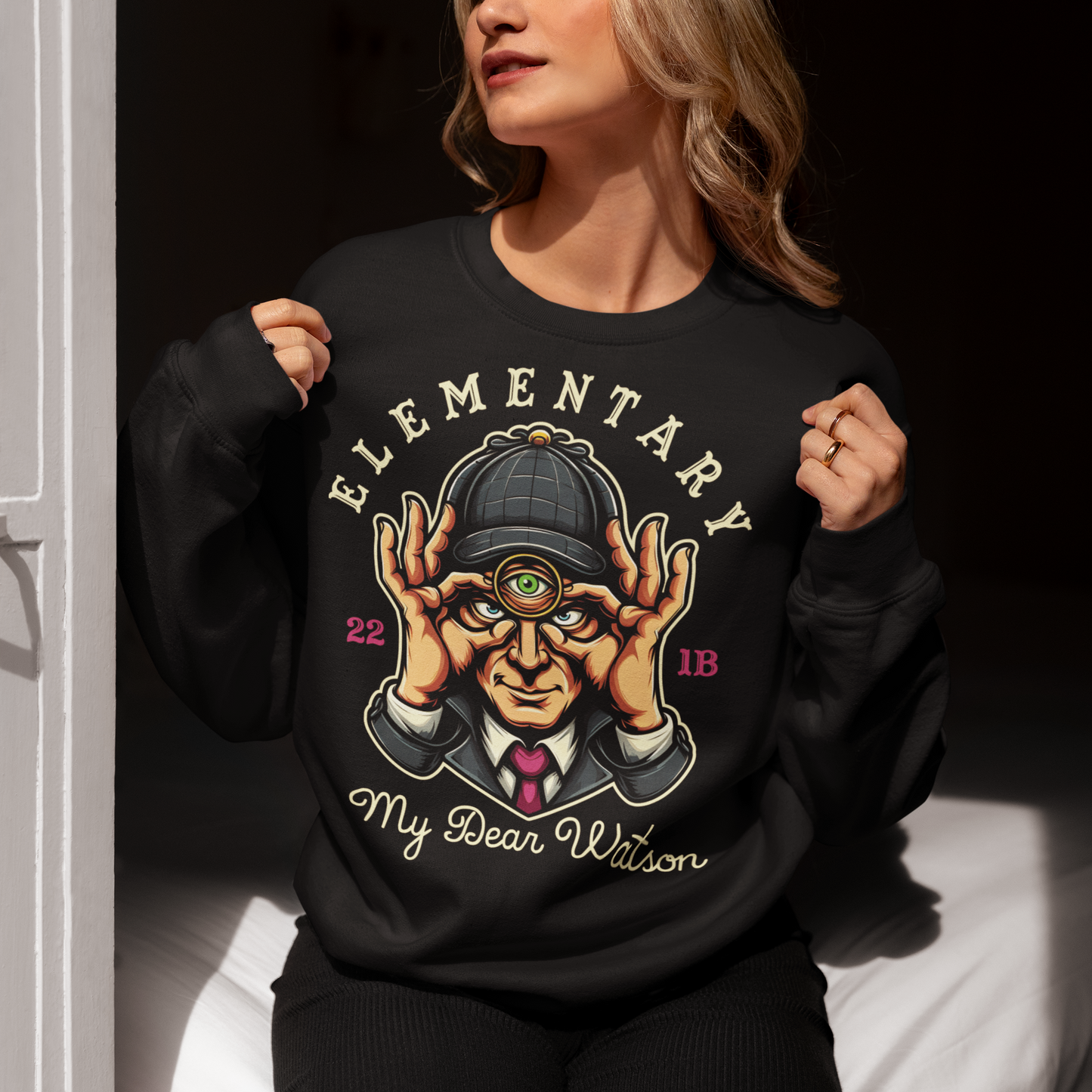 Black sweatshirt of Sherlock Holmes with a third eye and text ELEMENTARY MY DEAR WATSON.