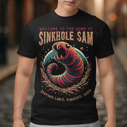 Unleash your inner cryptid enthusiast with our exclusive Sinkhole Sam T-Shirt! This tee features a bold, vibrant graphic of the legendary creature from Kansas folklore, brought to life in stunning detail. Sinkhole Sam, the elusive serpent-like beast rumored to inhabit the deep waters of Inman Lake, is depicted in a dramatic, eye-catching design that captures the mystery and excitement of this local legend.