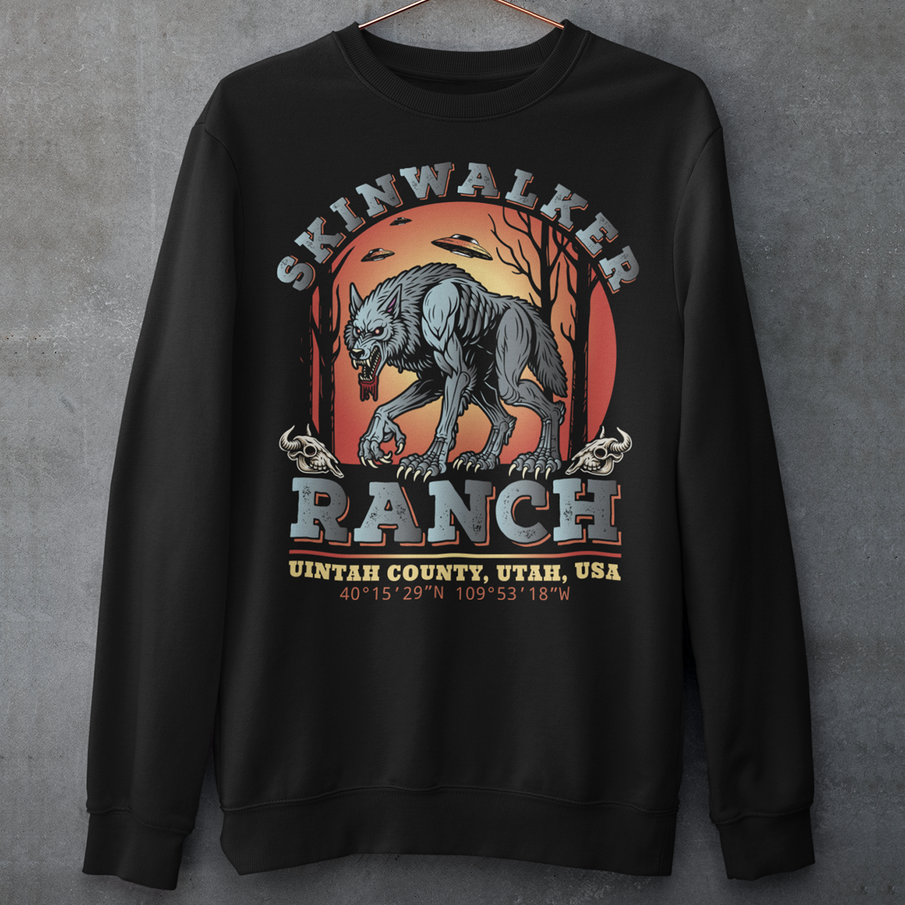 Black sweatshirt of a wolf on skinwalker ranch with UFO's in the sky with text SKINWALKER RANCH.