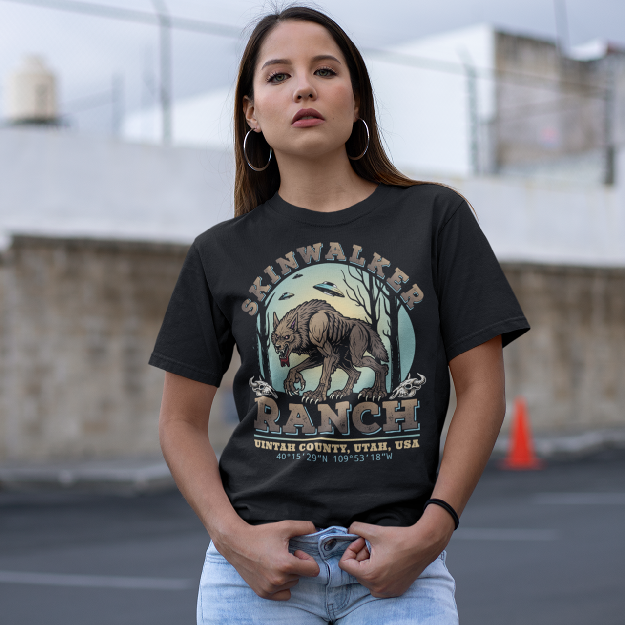 Black t-shirt of a wolf on skinwalker ranch with UFO's in the sky with text SKINWALKER RANCH.