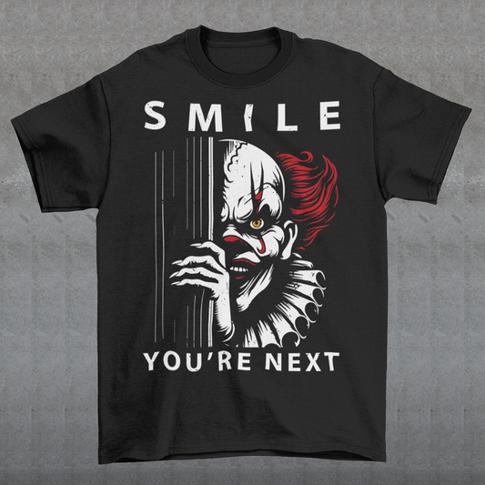 Introducing our chillingly captivating t-shirt design, "SMILE YOU'RE NEXT." This bone-chilling masterpiece features a sinister, grinning killer clown, designed to send shivers down your spine. The intricate details of the clown's malevolent expression are both mesmerizing and haunting, drawing you into the depths of its dark persona.