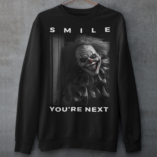 Black sweatshirt of a killer clown with text SMILE YOURE NEXT.