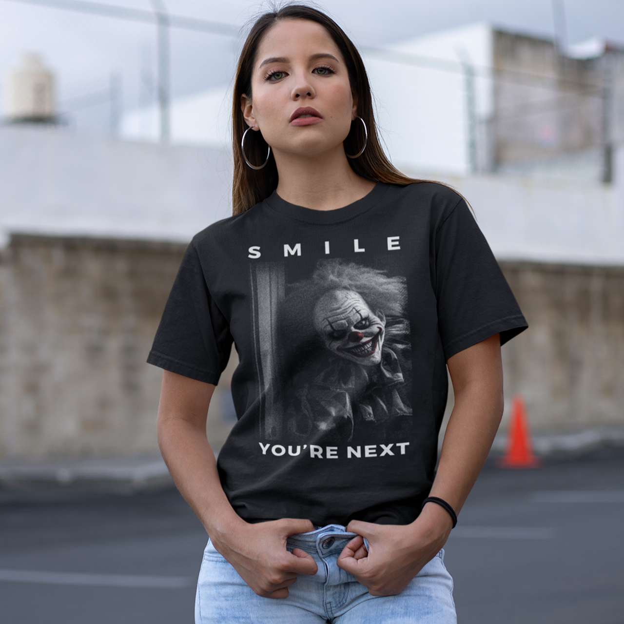 Black t-shirt of a grinning killer clown with text "SMILE YOU'RE NEXT".