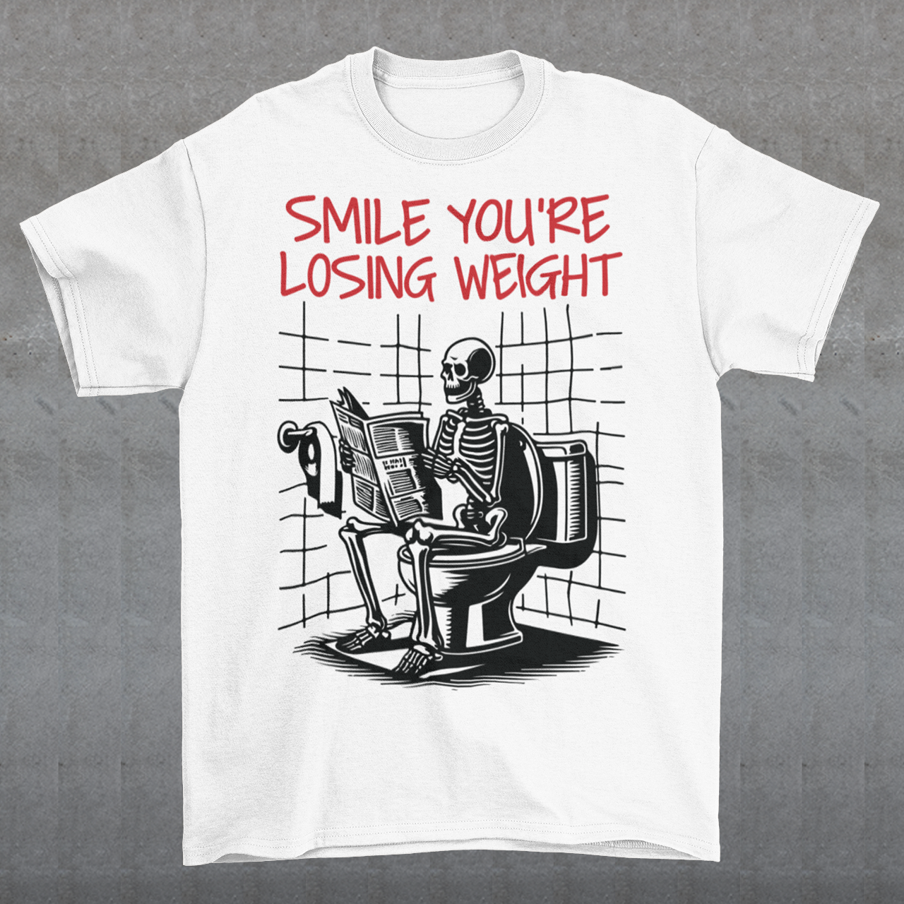 A humorous t-shirt design featuring a cartoon skeleton sitting on a toilet, legs crossed, casually reading a newspaper. The skeleton has a relaxed, almost cheerful expression, emphasizing the absurdity of the scene. Above the image, bold text reads: "SMILE YOU'RE LOSING WEIGHT," playing on the double meaning of weight loss and the skeleton’s bony frame. The design blends bathroom humor with ironic positivity for a lighthearted laugh.