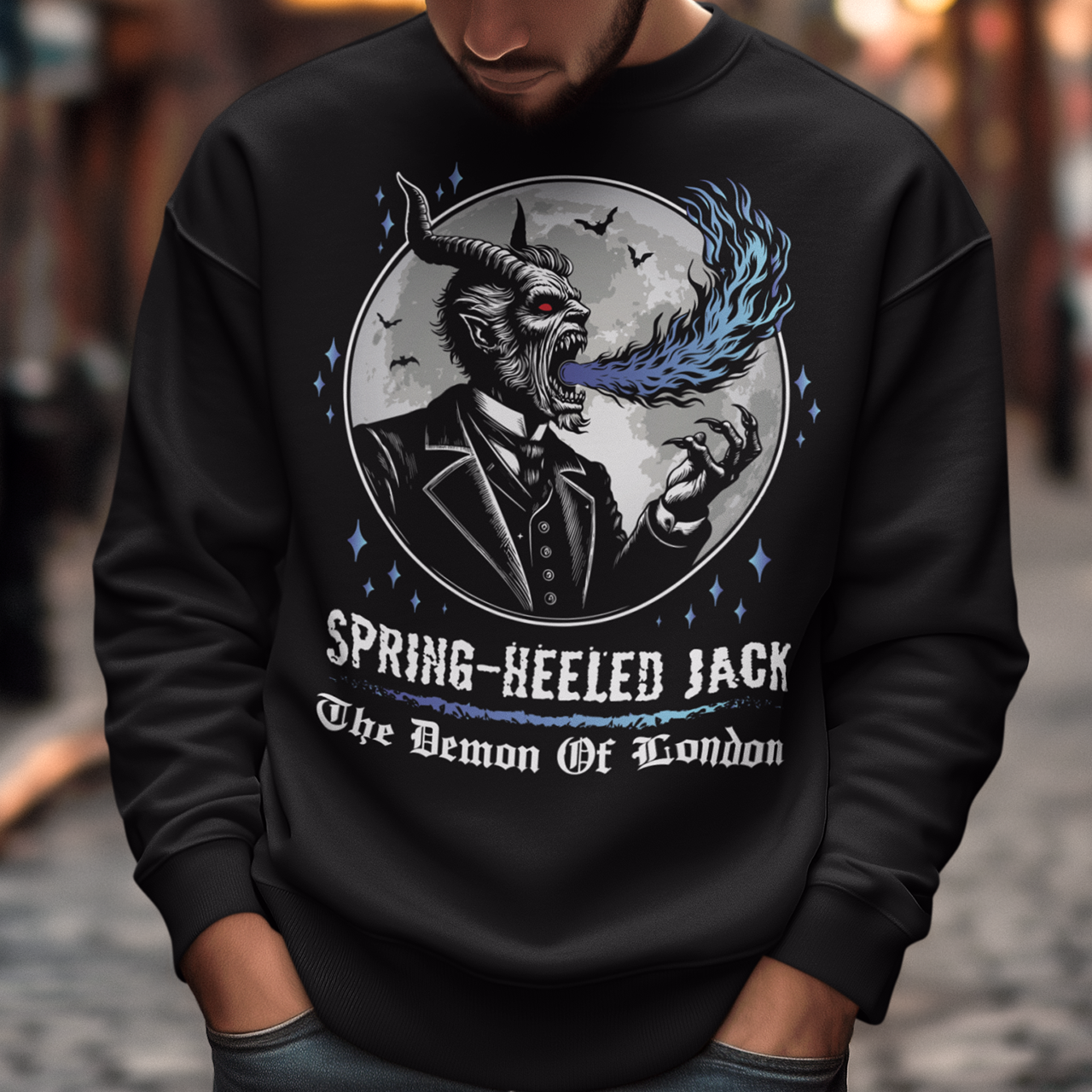 Introducing our electrifying Spring-heeled Jack sweatshirt, a striking fusion of folklore and urban legend! Against the backdrop of a hauntingly illuminated moon, Spring-heeled Jack leaps into action, exhaling flames with an otherworldly flair. This enigmatic figure, shrouded in mystery and mischief, has long captured the imagination of Londoners and beyond. With intricate detail and bold colors, our design brings to life the infamous character known as the "Demon of London.