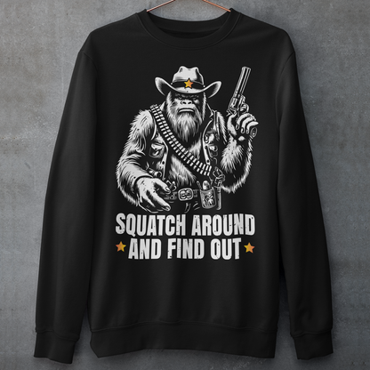 Black sweatshirt of a sheriff Sasquatch in the wild west holding a gun with text underneath SQUATCH AROUND AND FIND OUT.