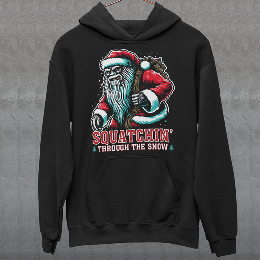 Black Christmas hoodie of a Santa sasquatch and text "Squatchin' through the snow."