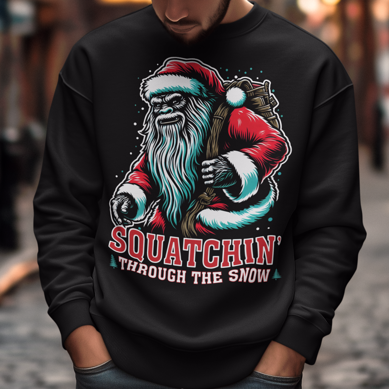 Black Christmas sweatshirt of a Santa sasquatch and text "Squatchin' through the snow."