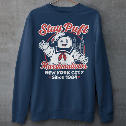 Bring some sweet nostalgia to your wardrobe with this Stay Puft Marshmallows Sweatshirt! Featuring the iconic Stay Puft Marshmallow Man, this design captures the perfect mix of charm and chaos. The bold text “Stay Puft Marshmallows” adds a vintage, retro-advertisement vibe — just like the classic 80s original.