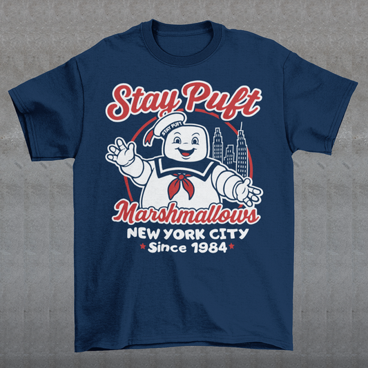Bring some sweet nostalgia to your wardrobe with this Stay Puft Marshmallows T-Shirt! Featuring the iconic Stay Puft Marshmallow Man, this design captures the perfect mix of charm and chaos. The bold text “Stay Puft Marshmallows” adds a vintage, retro-advertisement vibe — just like the classic 80s original.