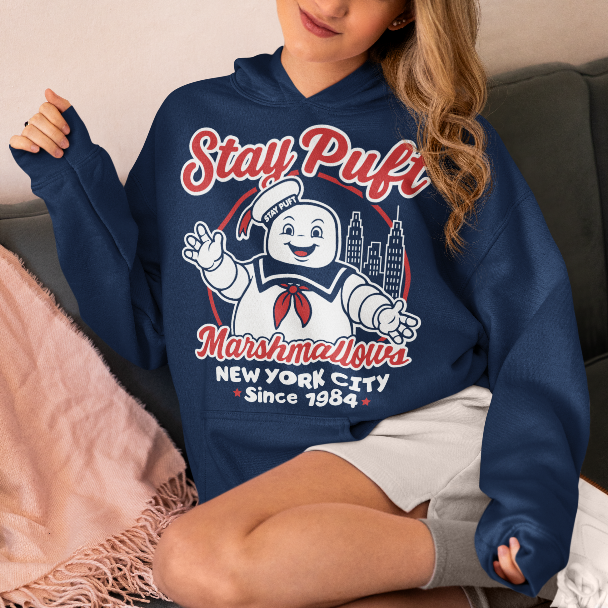 Bring some sweet nostalgia to your wardrobe with this Stay Puft Marshmallows Hoodie! Featuring the iconic Stay Puft Marshmallow Man, this design captures the perfect mix of charm and chaos. The bold text “Stay Puft Marshmallows” adds a vintage, retro-advertisement vibe — just like the classic 80s original.