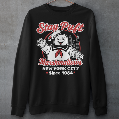 Bring some sweet nostalgia to your wardrobe with this Stay Puft Marshmallows Sweatshirt! Featuring the iconic Stay Puft Marshmallow Man, this design captures the perfect mix of charm and chaos. The bold text “Stay Puft Marshmallows” adds a vintage, retro-advertisement vibe — just like the classic 80s original.