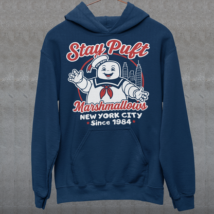 Bring some sweet nostalgia to your wardrobe with this Stay Puft Marshmallows Hoodie! Featuring the iconic Stay Puft Marshmallow Man, this design captures the perfect mix of charm and chaos. The bold text “Stay Puft Marshmallows” adds a vintage, retro-advertisement vibe — just like the classic 80s original.