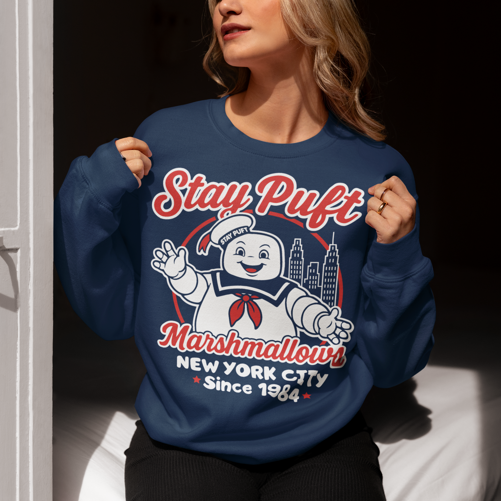 Bring some sweet nostalgia to your wardrobe with this Stay Puft Marshmallows Sweatshirt! Featuring the iconic Stay Puft Marshmallow Man, this design captures the perfect mix of charm and chaos. The bold text “Stay Puft Marshmallows” adds a vintage, retro-advertisement vibe — just like the classic 80s original.