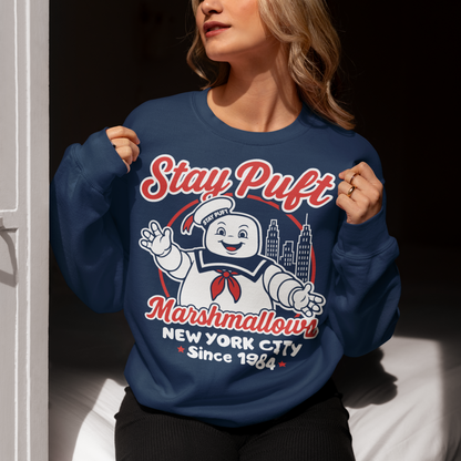 Bring some sweet nostalgia to your wardrobe with this Stay Puft Marshmallows Sweatshirt! Featuring the iconic Stay Puft Marshmallow Man, this design captures the perfect mix of charm and chaos. The bold text “Stay Puft Marshmallows” adds a vintage, retro-advertisement vibe — just like the classic 80s original.