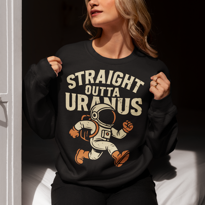 Make the galaxy laugh with this bold and hilarious sweatshirt! Featuring a cartoon-style spaceman floating in the cosmos, this shirt makes a cosmic statement with the cheeky slogan "STRAIGHT OUTTA URANUS" printed above. Perfect for space nerds, pun-lovers, and anyone who appreciates a little interstellar humor. Whether you’re stargazing, gaming, or just looking to get a few laughs, this shirt is guaranteed to be a conversation starter.