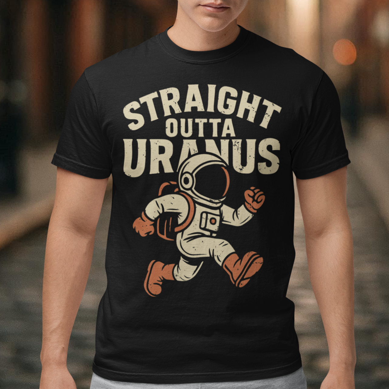 Make the galaxy laugh with this bold and hilarious tee! Featuring a cartoon-style spaceman floating in the cosmos, this shirt makes a cosmic statement with the cheeky slogan "STRAIGHT OUTTA URANUS" printed above. Perfect for space nerds, pun-lovers, and anyone who appreciates a little interstellar humor. Whether you’re stargazing, gaming, or just looking to get a few laughs, this shirt is guaranteed to be a conversation starter.
