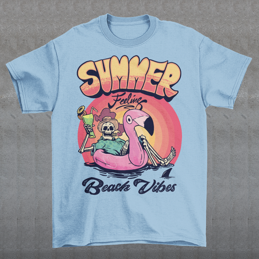 Introducing our "Summer Feeling Beach Vibes" t-shirt, a delightful blend of relaxation, whimsy, and cool vibes. This eye-catching design captures the essence of summer with a unique twist. At the center of the design, you'll find a playful skeleton, bringing a touch of the extraordinary to your beach adventures. Poised atop a vibrant rubber flamingo, the skeleton floats effortlessly on the tranquil sea, adding a sense of surrealism and fun to the scene.