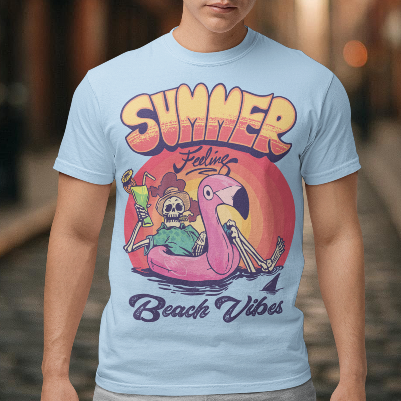 Introducing our "Summer Feeling Beach Vibes" t-shirt, a delightful blend of relaxation, whimsy, and cool vibes. This eye-catching design captures the essence of summer with a unique twist. At the center of the design, you'll find a playful skeleton, bringing a touch of the extraordinary to your beach adventures. Poised atop a vibrant rubber flamingo, the skeleton floats effortlessly on the tranquil sea, adding a sense of surrealism and fun to the scene.