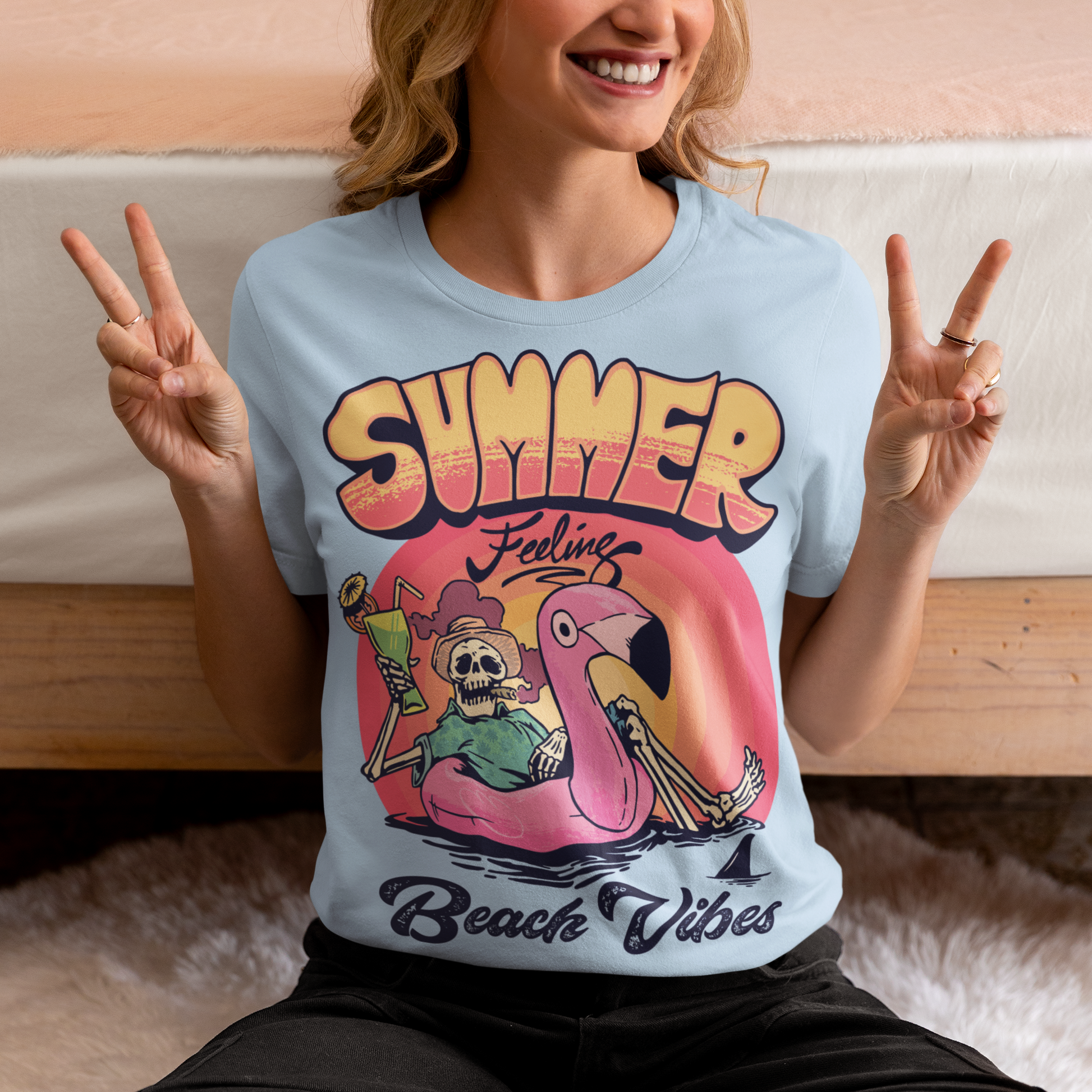 Introducing our "Summer Feeling Beach Vibes" t-shirt, a delightful blend of relaxation, whimsy, and cool vibes. This eye-catching design captures the essence of summer with a unique twist. At the center of the design, you'll find a playful skeleton, bringing a touch of the extraordinary to your beach adventures. Poised atop a vibrant rubber flamingo, the skeleton floats effortlessly on the tranquil sea, adding a sense of surrealism and fun to the scene.