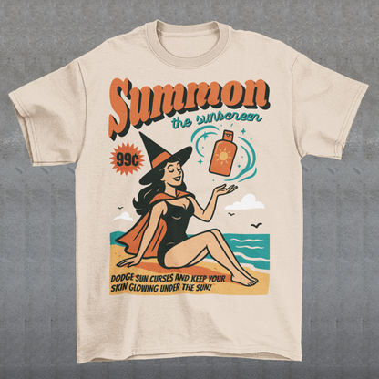 Bring a little magic to your summer with this whimsical tee! Featuring a playful illustration of a witch lounging on the shore, sunhat tilted and a bottle of sunscreen within arm’s reach, this design blends spooky charm with sunny vibes. Bold text above reads SUMMON THE SUNSCREEN in an enchanting font, making it perfect for anyone who loves both moonlit rituals and seaside relaxation.