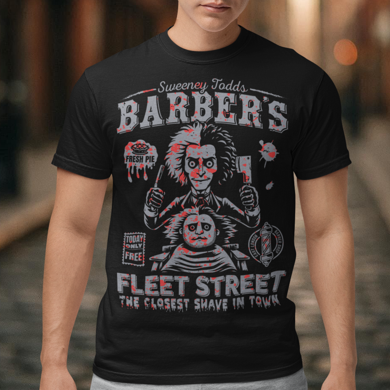This bold shirt pays tribute to Sweeney Todd’s Barber Shop, the infamous haunt of Fleet Street. The shirt captures the eerie charm of the Demon Barber himself. Perfect for theatre fans, horror enthusiasts, or anyone with a taste for the macabre, this shirt is equal parts stylish and sinister.