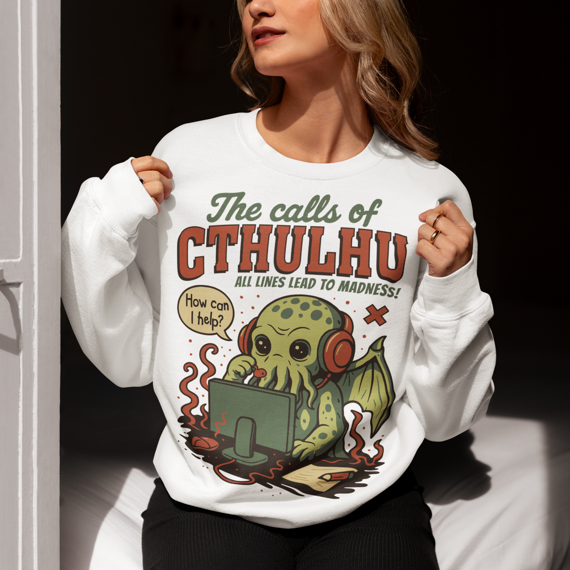 Answer the call of cosmic chaos with this irresistibly cute Cthulhu sweatshirt, where eldritch horror meets everyday office despair. Featuring everyone’s favorite ancient entity manning a help desk, headset on and sanity slipping, this design jokes that all lines eventually lead to madness. Soft, comfy, and packed with dark humor, it’s perfect for Lovecraft fans, RPG players, horror geeks, and anyone who’s ever worked customer support and stared into the abyss.