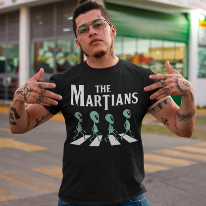 "Step into the extraterrestrial realm with our exclusive 'THE MARTIANS' t-shirt. This eye-catching design showcases four uniquely crafted aliens confidently crossing a road, adding a touch of whimsy and intrigue to your style. Printed with vibrant colors and intricate details, this shirt sparks curiosity about what lies beyond our planet. Embrace a blend of cosmic charm and playful imagination with 'THE MARTIANS' tee, inviting conversation and celebrating the mysteries of the universe in style."