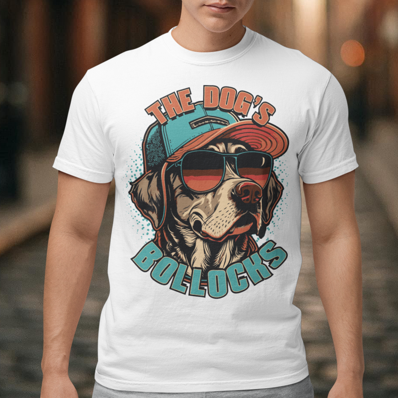 Introducing our funky and hilarious t-shirt featuring a cool canine companion who's ready to take the fashion world by storm. This attention-grabbing design showcases a lovable dog wearing a stylish cap and trendy sunglasses. With an air of confidence and undeniable charm, this pup is sure to turn heads wherever you go. Emblazoned across the front of the shirt, you'll find the bold and cheeky text "THE DOG'S BOLLOCKS." It's a witty nod to the dog's confident demeanor and undeniable swagger.