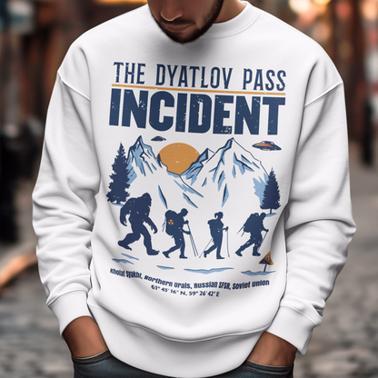 Embark on an enigmatic journey with our captivating 'Dyatlov Pass Incident' t-shirt! This unique design captures the mystique of snowy mountain ranges, featuring a group of adventurous hikers traversing the wintry landscape. Amidst the serene snow-covered peaks, mysterious UFOs hover above, adding an element of otherworldly intrigue to the scene. At the tail end of the group stands the elusive figure of Bigfoot, shrouded in the enigma of the untamed wilderness.