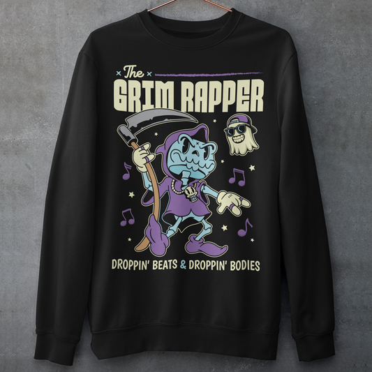 Introducing our electrifying "The Grim Rapper" Sweatshirt – a fusion of humor, music, and the afterlife that will make heads turn and beats drop! This exclusive design features a lively cartoon rendition of the Grim Reaper, decked out in rap gear confidently dropping rhymes. Surrounding the Grim Rapper are playful musical notes that dance in harmony with the rhythm. Above the charismatic cartoon character, bold text proudly declares, "THE GRIM RAPPER."