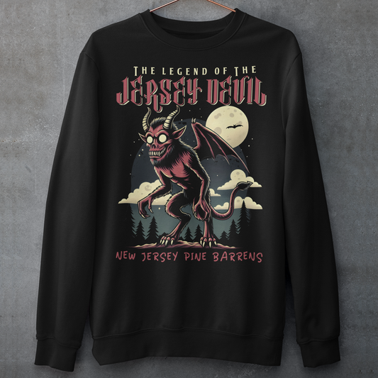 "Embrace the mystery with our Jersey Devil sweatshirt! Featuring a striking depiction of the legendary creature , this shirt captures the intrigue and folklore of the New Jersey Pine Barrens. Above, bold letters declare 'THE LEGEND OF THE JERSEY DEVIL,' invoking tales of its enigmatic presence. Below, 'THE NEW JERSEY PINE BARRENS' grounds the design in the eerie beauty of its natural habitat. Wear it to ignite conversations and inspire curiosity about this enduring myth."