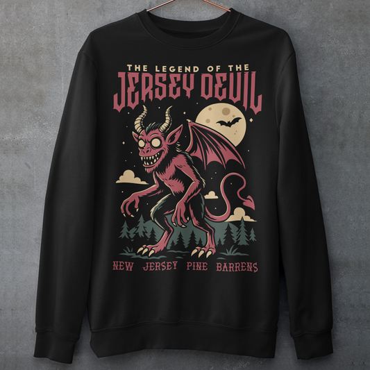 "Embrace the mystery with our Jersey Devil sweatshirt! Featuring a striking depiction of the legendary creature , this shirt captures the intrigue and folklore of the New Jersey Pine Barrens. Above, bold letters declare 'THE LEGEND OF THE JERSEY DEVIL,' invoking tales of its enigmatic presence. Below, 'THE NEW JERSEY PINE BARRENS' grounds the design in the eerie beauty of its natural habitat. Wear it to ignite conversations and inspire curiosity about this enduring myth."