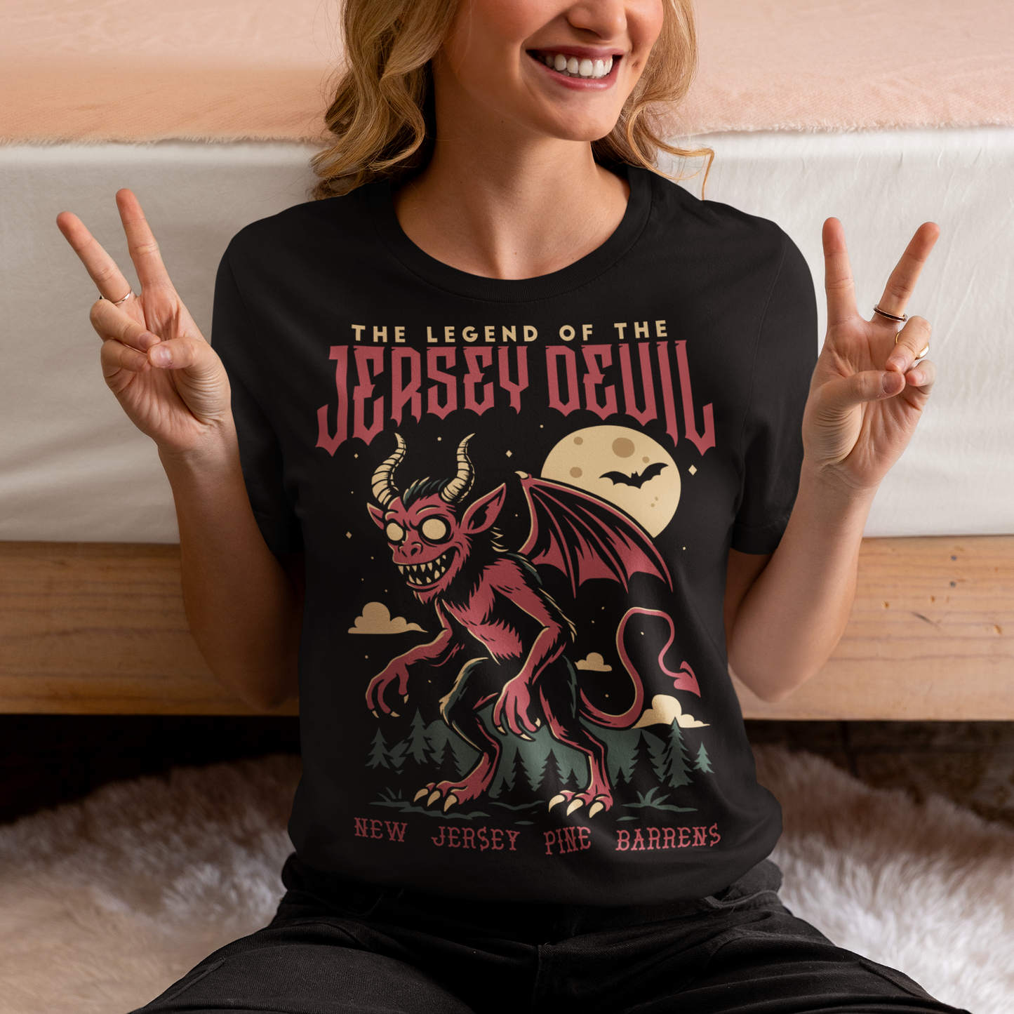 "Embrace the mystery with our Jersey Devil t-shirt! Featuring a striking depiction of the legendary creature , this shirt captures the intrigue and folklore of the New Jersey Pine Barrens. Above, bold letters declare 'THE LEGEND OF THE JERSEY DEVIL,' invoking tales of its enigmatic presence. Below, 'THE NEW JERSEY PINE BARRENS' grounds the design in the eerie beauty of its natural habitat. Wear it to ignite conversations and inspire curiosity about this enduring myth."