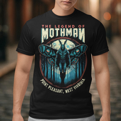 This captivating t-shirt features a striking illustration of Mothman, the legendary cryptid, standing mysteriously in a dense, shadowy forest. The eerie scene captures the essence of folklore, with Mothman's glowing red eyes piercing through the darkness, creating an atmosphere of both intrigue and suspense. Above the enigmatic figure, bold text reads "THE LEGEND OF MOTHMAN," adding to the mystique and allure of this mythical creature.
