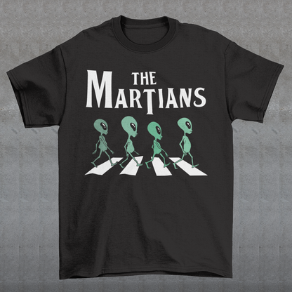 "Step into the extraterrestrial realm with our exclusive 'THE MARTIANS' t-shirt. This eye-catching design showcases four uniquely crafted aliens confidently crossing a road, adding a touch of whimsy and intrigue to your style. Printed with vibrant colors and intricate details, this shirt sparks curiosity about what lies beyond our planet. Embrace a blend of cosmic charm and playful imagination with 'THE MARTIANS' tee, inviting conversation and celebrating the mysteries of the universe in style."