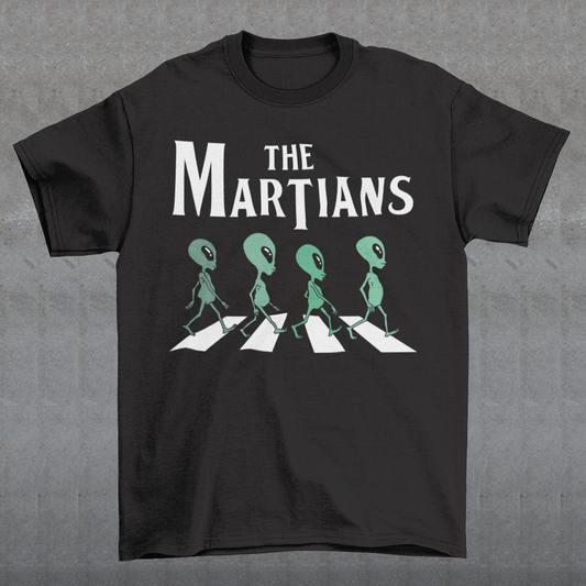 "Step into the extraterrestrial realm with our exclusive 'THE MARTIANS' t-shirt. This eye-catching design showcases four uniquely crafted aliens confidently crossing a road, adding a touch of whimsy and intrigue to your style. Printed with vibrant colors and intricate details, this shirt sparks curiosity about what lies beyond our planet. Embrace a blend of cosmic charm and playful imagination with 'THE MARTIANS' tee, inviting conversation and celebrating the mysteries of the universe in style."