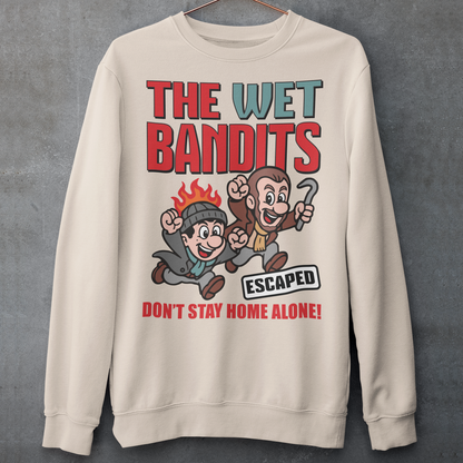 Bring some nostalgic mischief to your wardrobe with this “The Wet Bandits – Don’t Stay Home Alone!” sweatshirt! Inspired by the classic holiday comedy, this fun retro-style design features a cartoon version of the iconic burglar duo in bold, vintage colors. Perfect for fans of 90s movies, Christmas classics, and throwback humor, this shirt blends playful artwork with cozy comfort.