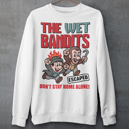 Bring some nostalgic mischief to your wardrobe with this “The Wet Bandits – Don’t Stay Home Alone!” sweatshirt! Inspired by the classic holiday comedy, this fun retro-style design features a cartoon version of the iconic burglar duo in bold, vintage colors. Perfect for fans of 90s movies, Christmas classics, and throwback humor, this shirt blends playful artwork with cozy comfort.