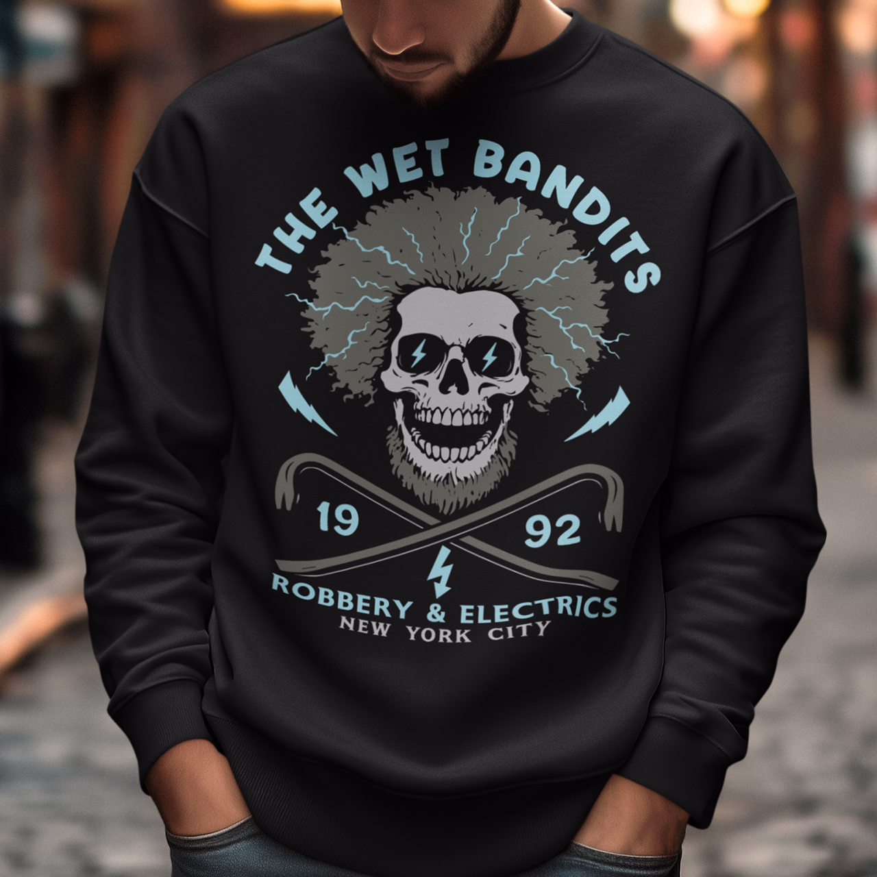 Shock your style to life with this “The Wet Bandits – Robbery And Electrics” sweatshirt! Featuring a bold skull design with wild electric hair, crossed crowbars, and vintage lettering, this tee blends rock-n-roll attitude with classic movie nostalgia. Inspired by the unforgettable duo from the holiday favorite, it’s perfect for fans who love edgy humor and retro vibes.